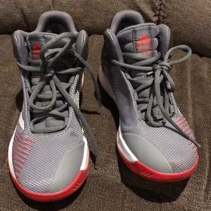 Adidas gray, white, and red big boy shoes.